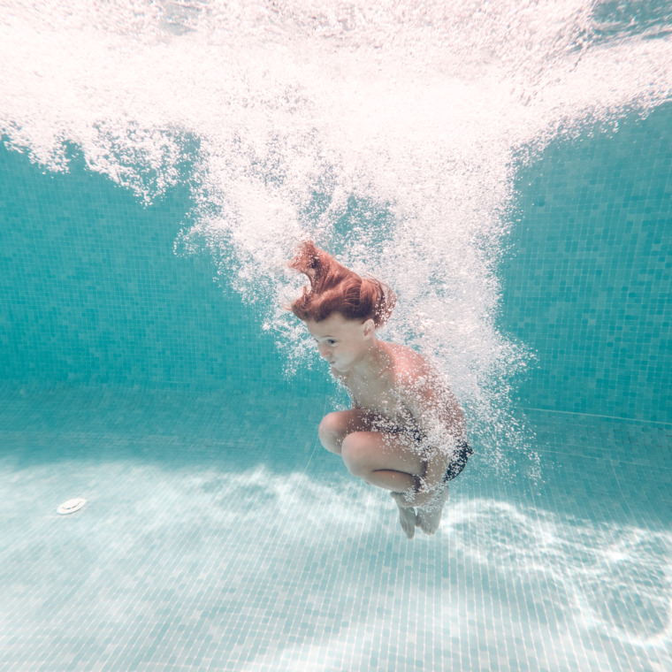 underwater-shot-of-boy-jumping-in-pool-water-2022-01-27-19-39-44-utc-760x760.jpg